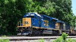 CSX 1714 SD23T4 leads a loaded work train with welded rails